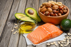 Selection of healthy fat sources, rustic background, selective focus, copy space