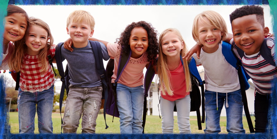 Portrait Of Excited Elementary School Pupils On Playing Field At Break Time