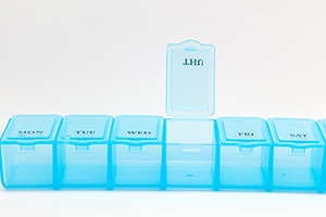 Closed up daily pill box show medicine equipment